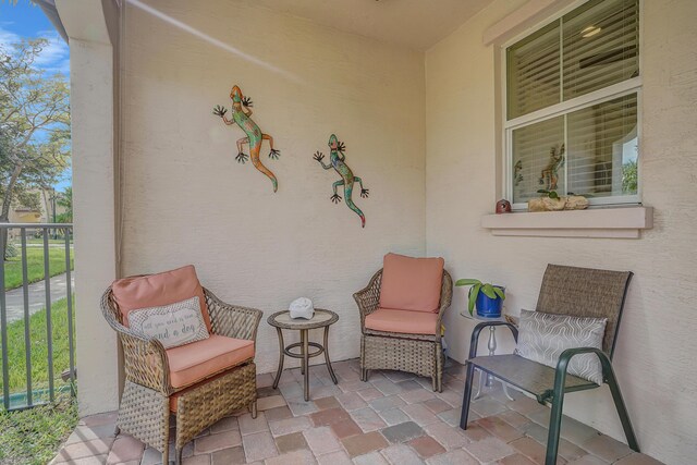 view of patio / terrace with a balcony