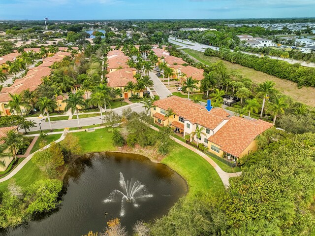 drone / aerial view with a residential view and a water view