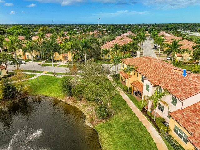 aerial view with a water view and a residential view