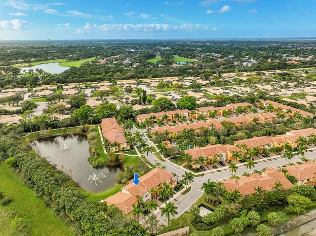 birds eye view of property featuring a water view and a residential view