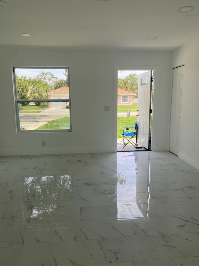 unfurnished room with a healthy amount of sunlight