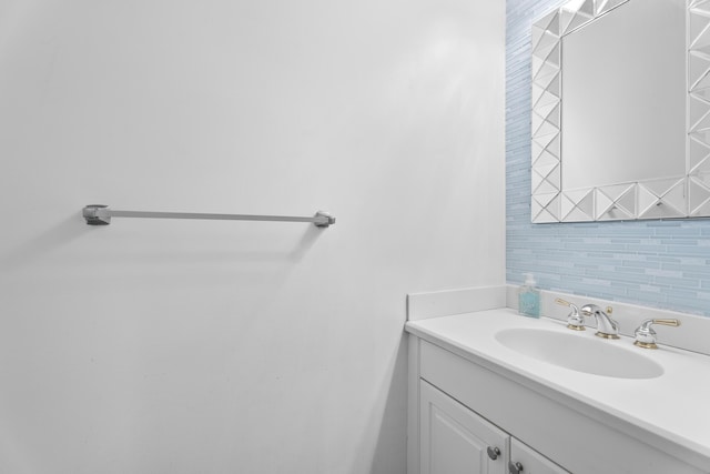 bathroom with vanity and backsplash