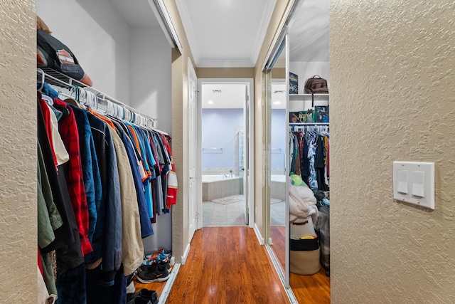 spacious closet featuring hardwood / wood-style flooring