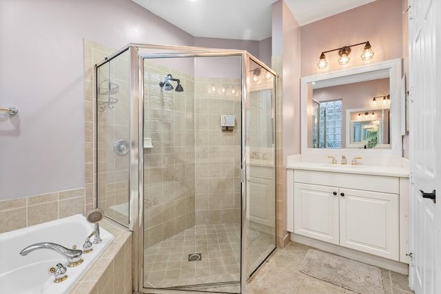 bathroom with tile patterned floors, vanity, and independent shower and bath