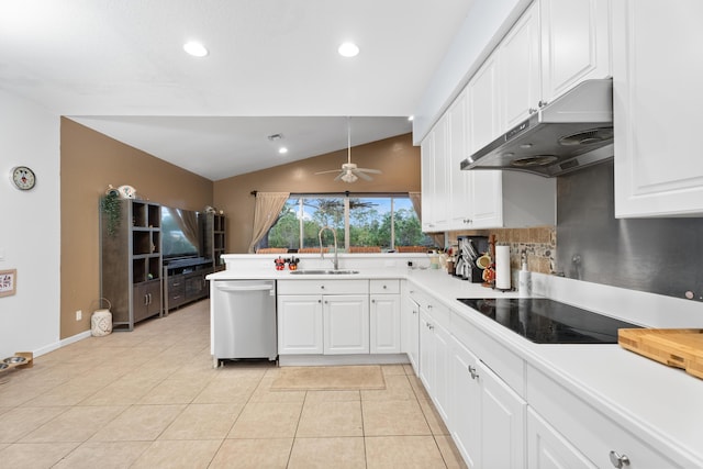 kitchen featuring black electric stovetop, dishwasher, sink, white cabinets, and lofted ceiling