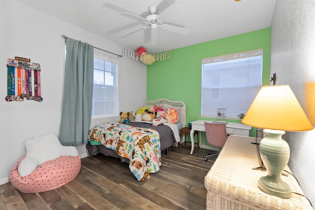 bedroom with ceiling fan and dark hardwood / wood-style floors