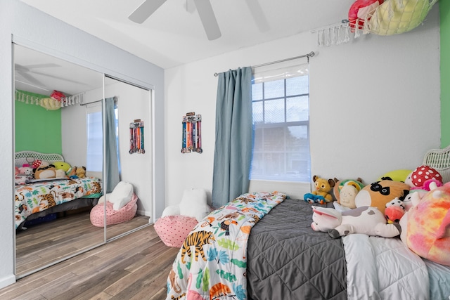 bedroom featuring a closet, ceiling fan, and hardwood / wood-style floors