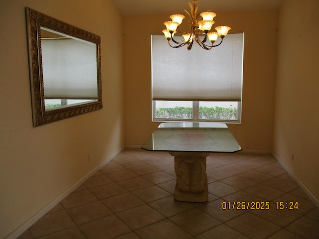 unfurnished dining area with tile patterned floors and a chandelier