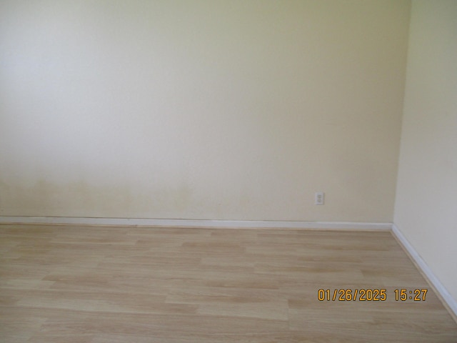 empty room with light wood-type flooring