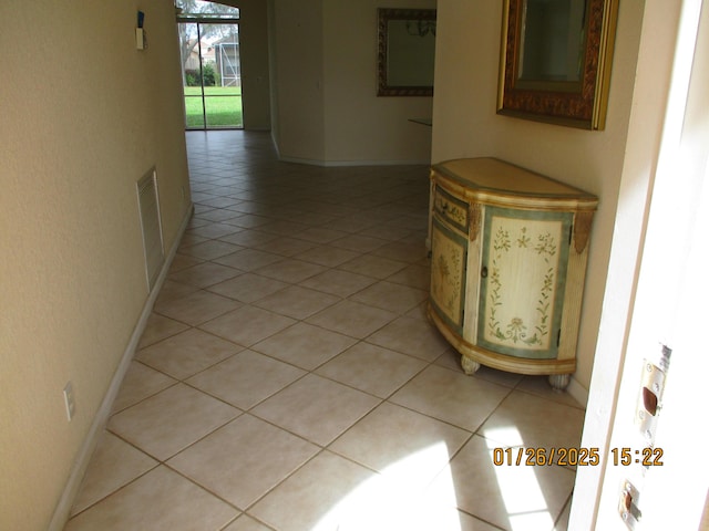 hallway with light tile patterned floors