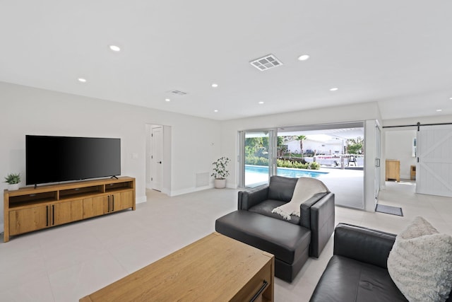 living room featuring a barn door