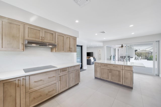 kitchen with light tile patterned flooring, ceiling fan, and black electric stovetop