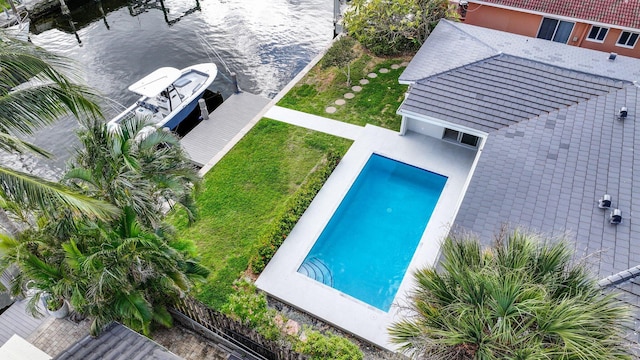 birds eye view of property featuring a water view