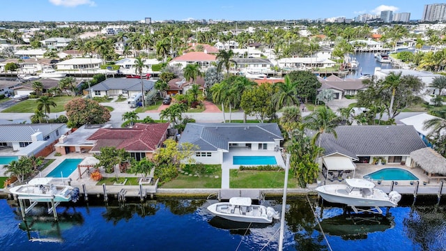 birds eye view of property with a water view