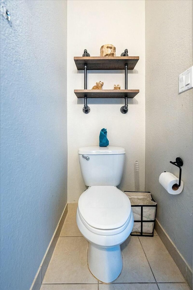 bathroom featuring tile patterned floors and toilet