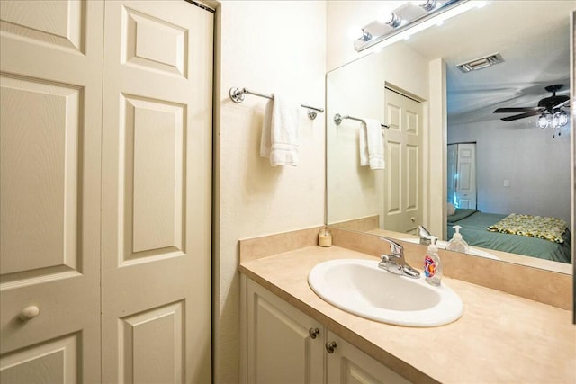 bathroom featuring ceiling fan and vanity