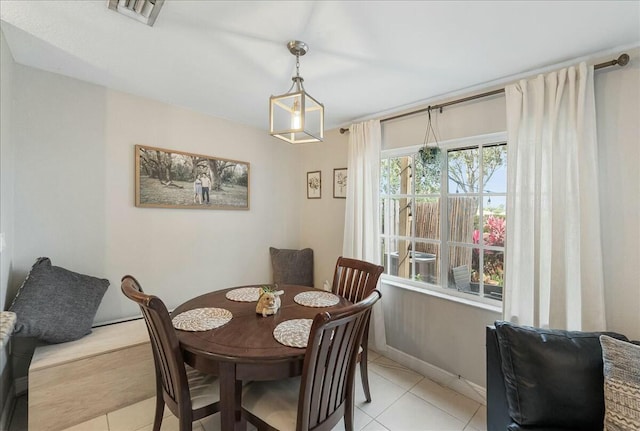 dining area with light tile patterned flooring