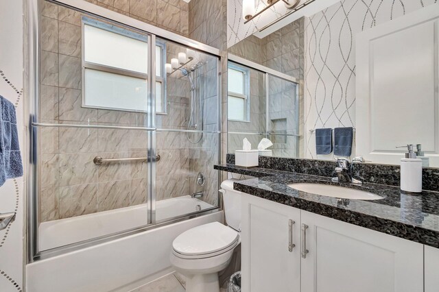 bathroom with wood-type flooring, vanity, and toilet