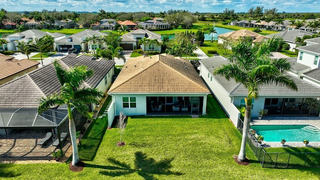 birds eye view of property with a residential view and a water view