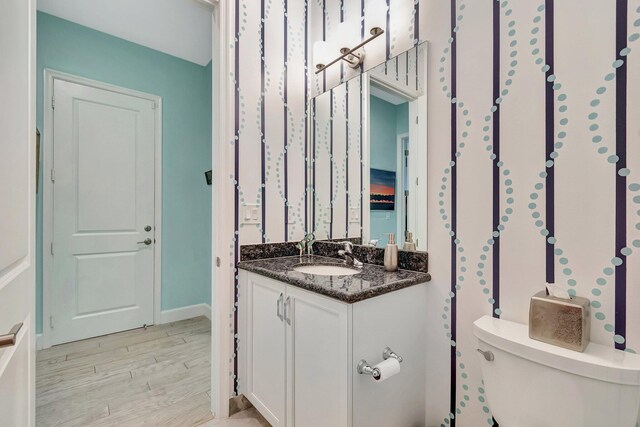 laundry area featuring cabinets, washing machine and dryer, sink, and light tile patterned floors