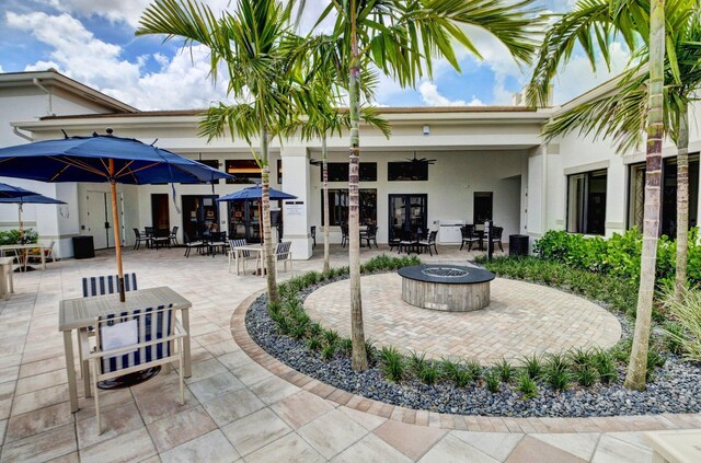 view of patio / terrace featuring an outdoor fire pit and french doors