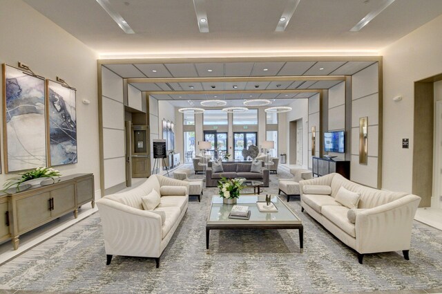 dining space featuring french doors, a high ceiling, and light wood-type flooring