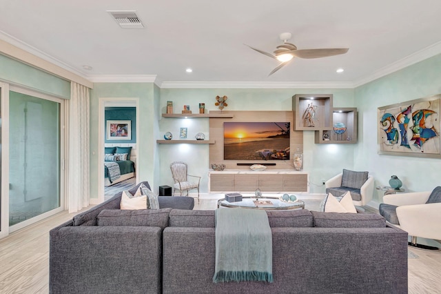 living room with crown molding, light hardwood / wood-style floors, and ceiling fan