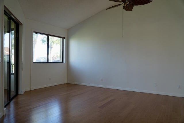 unfurnished room featuring ceiling fan, hardwood / wood-style floors, and lofted ceiling