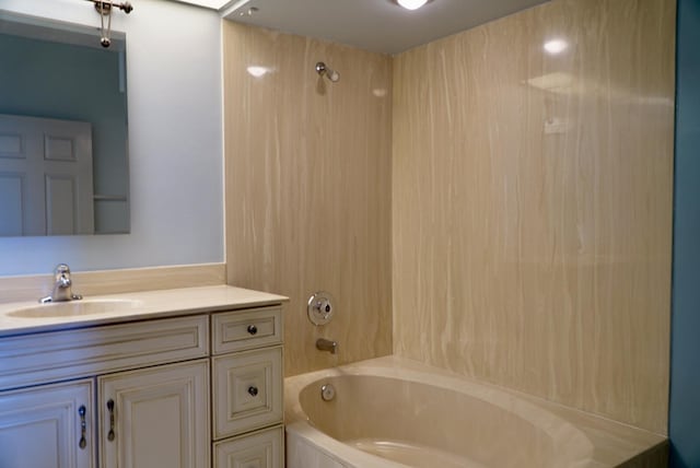 bathroom with tub / shower combination and vanity