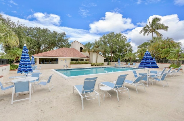 view of swimming pool featuring a patio area