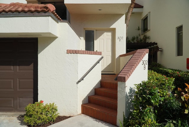 property entrance with a garage