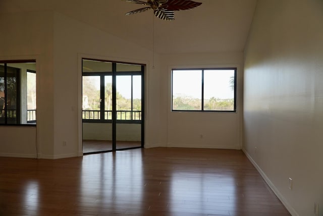 spare room with vaulted ceiling, ceiling fan, and hardwood / wood-style floors