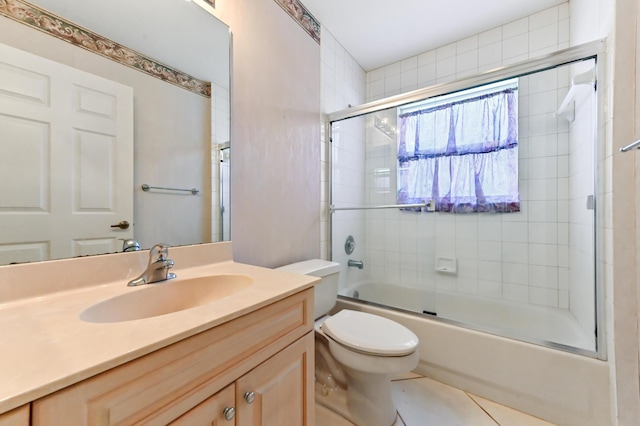 full bathroom with vanity, tile patterned flooring, enclosed tub / shower combo, and toilet