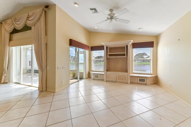 unfurnished living room featuring light tile patterned flooring, vaulted ceiling, and ceiling fan