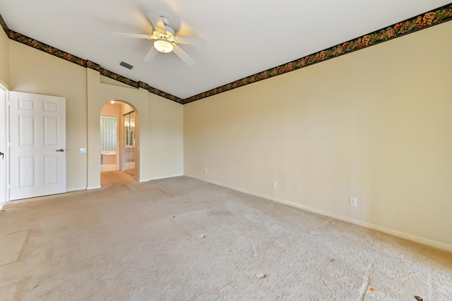 empty room with ceiling fan and carpet