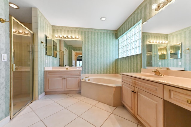 bathroom with vanity, tile patterned floors, and plus walk in shower