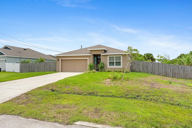 ranch-style home with a garage and a front yard