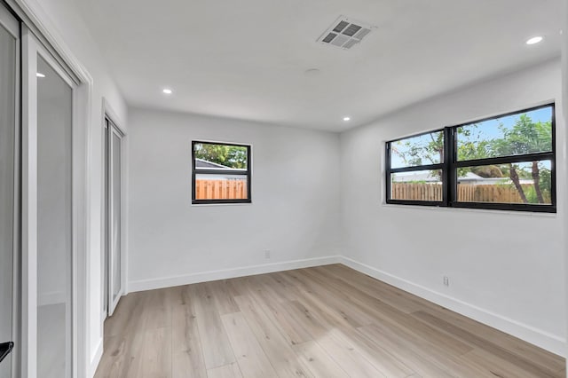 unfurnished bedroom with light wood-type flooring