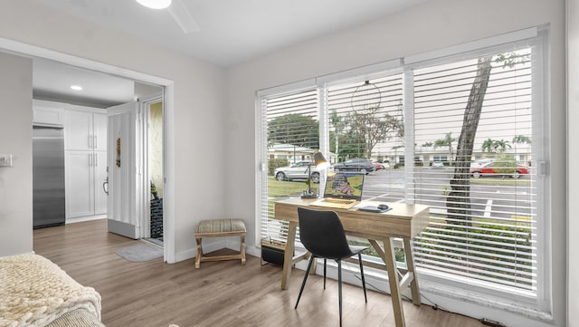 office with light hardwood / wood-style flooring