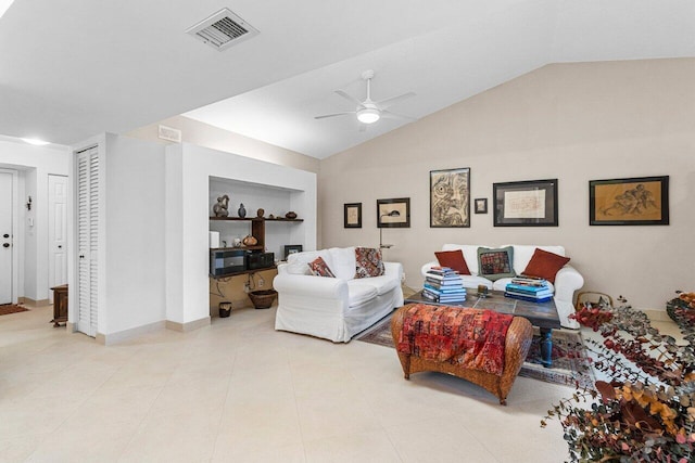 tiled living room featuring visible vents, baseboards, lofted ceiling, ceiling fan, and built in shelves