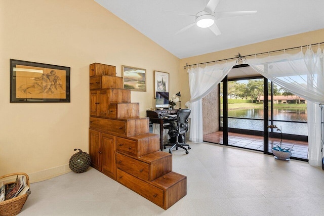 office space with lofted ceiling, ceiling fan, baseboards, and tile patterned floors