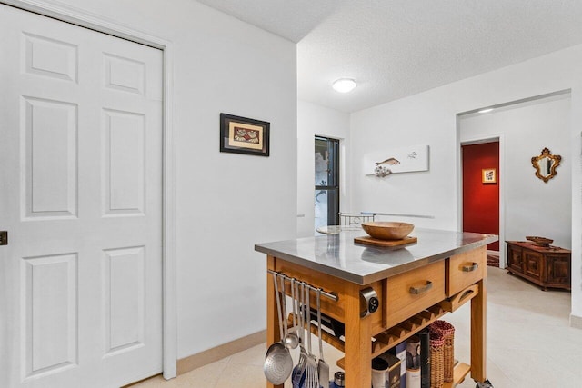 dining space with a textured ceiling