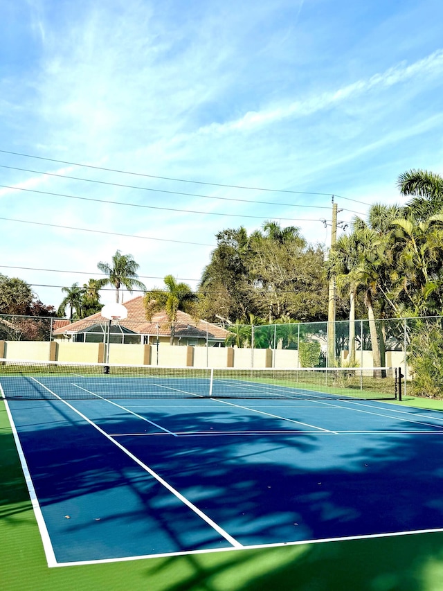 view of tennis court with fence