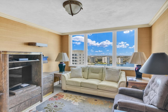 living room with ornamental molding and a water view