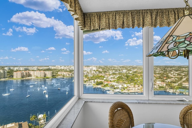 interior space with a water view and a healthy amount of sunlight