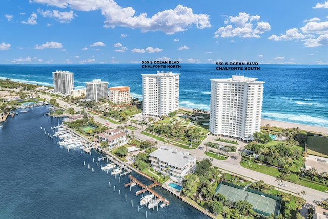 aerial view featuring a view of the beach and a water view