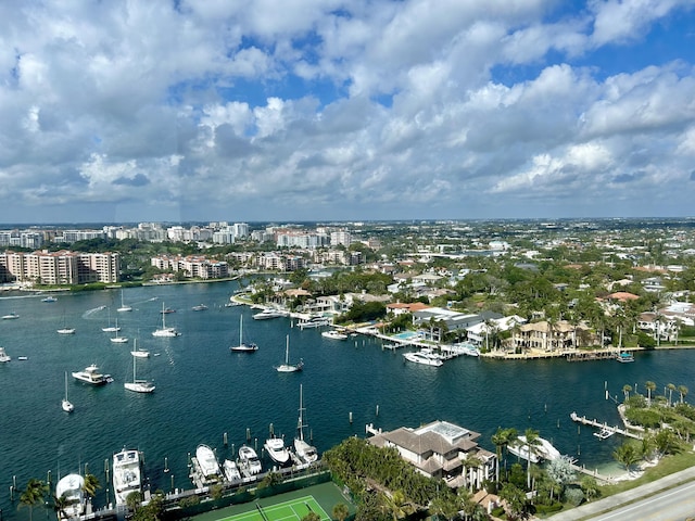 birds eye view of property with a view of city and a water view