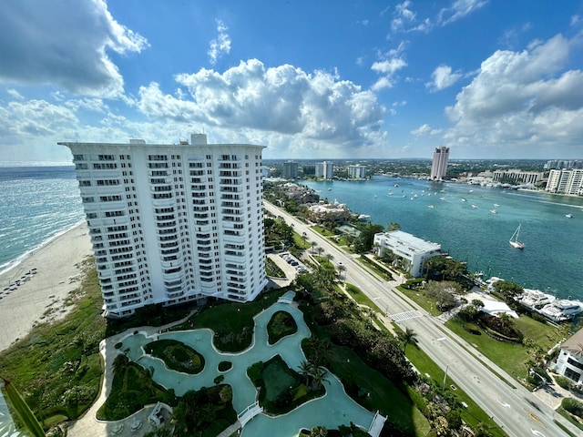 birds eye view of property featuring a water view and a city view