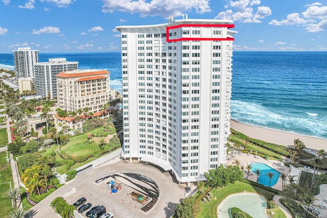 bird's eye view with a view of the beach and a water view