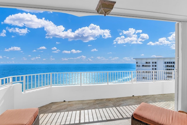 balcony featuring a water view